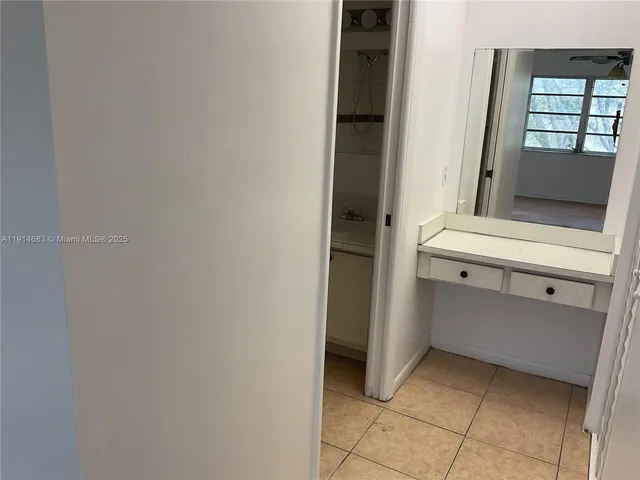 a view of cabinet and mirror