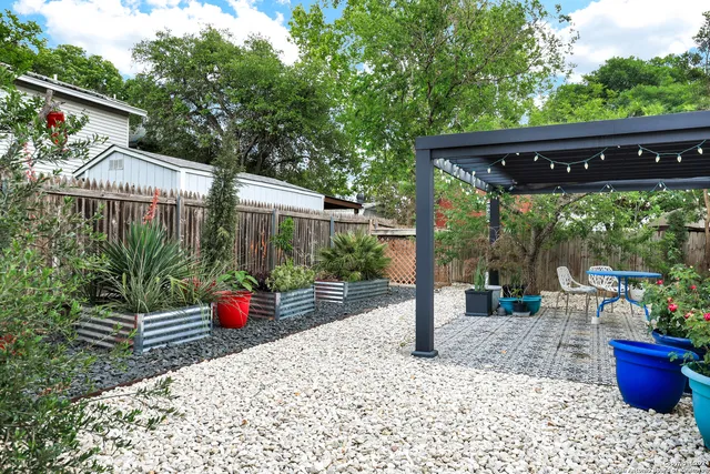 a backyard of a house with seating space