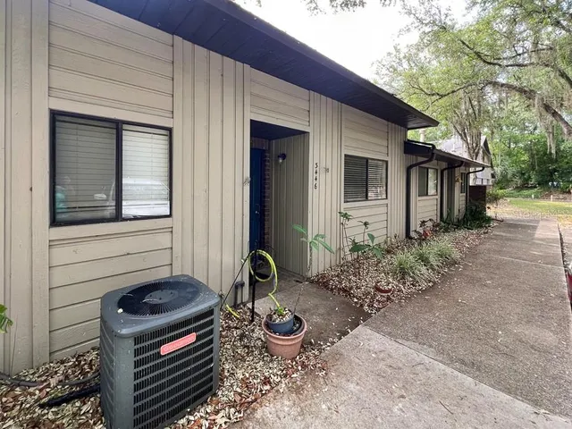 a backyard of a house with seating space