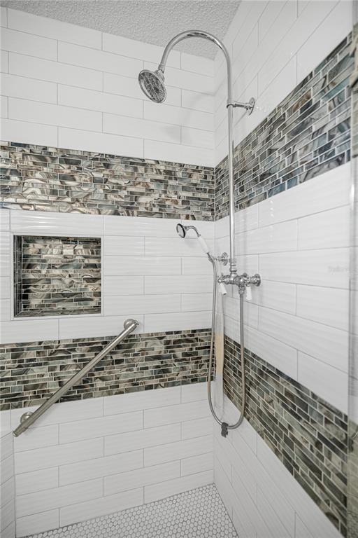 9438 Southwest 85th Avenue, Unit B Ocala, FL 34481 - Photo 13 of 32 a bathroom with a shower