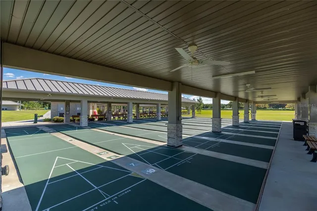 a view of a swimming pool with outdoor seating