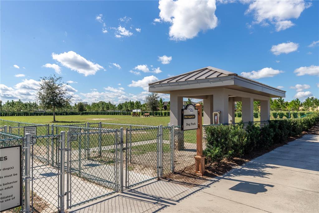 9438 Southwest 85th Avenue, Unit B Ocala, FL 34481 - Photo 30 of 32 a view of a house with a yard