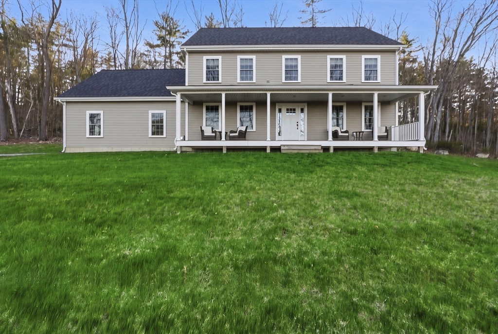 103 Rice Corner Road Brookfield, MA 01506 - Photo 33 of 39 a front view of a house with a yard and trees