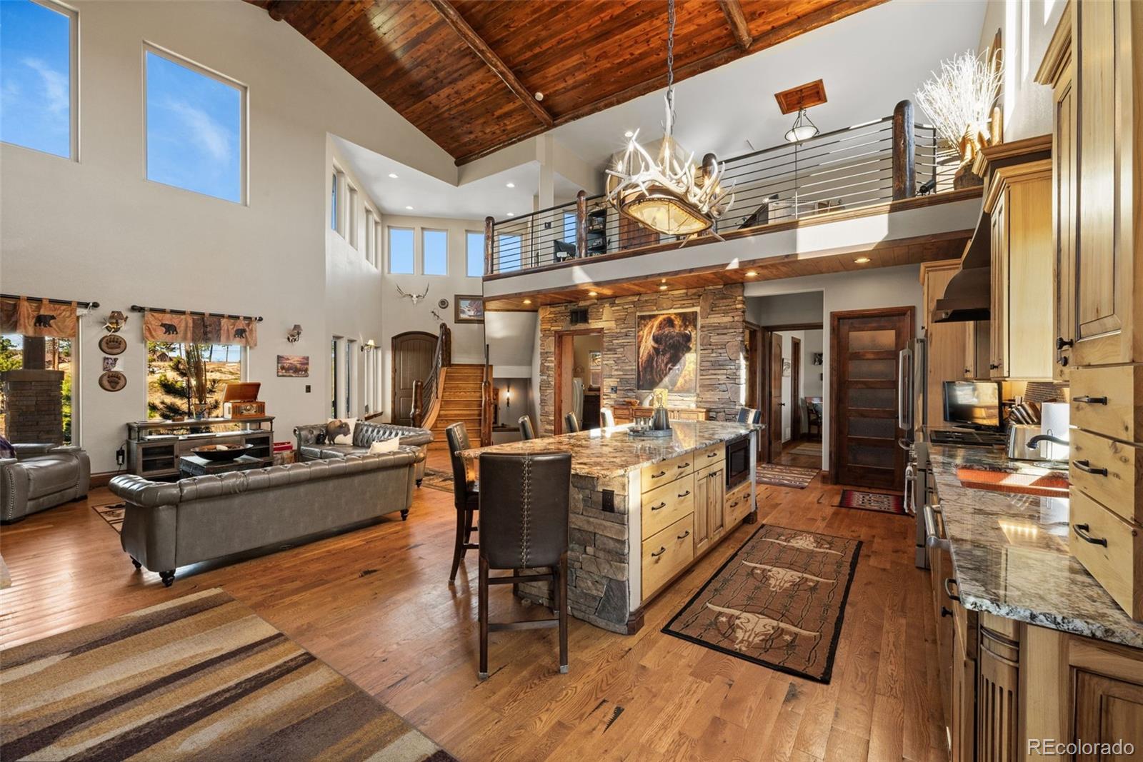 12875 Holmes Road Colorado Springs, CO 80908 - Photo 15 of 50 a view of a kitchen with table and chairs