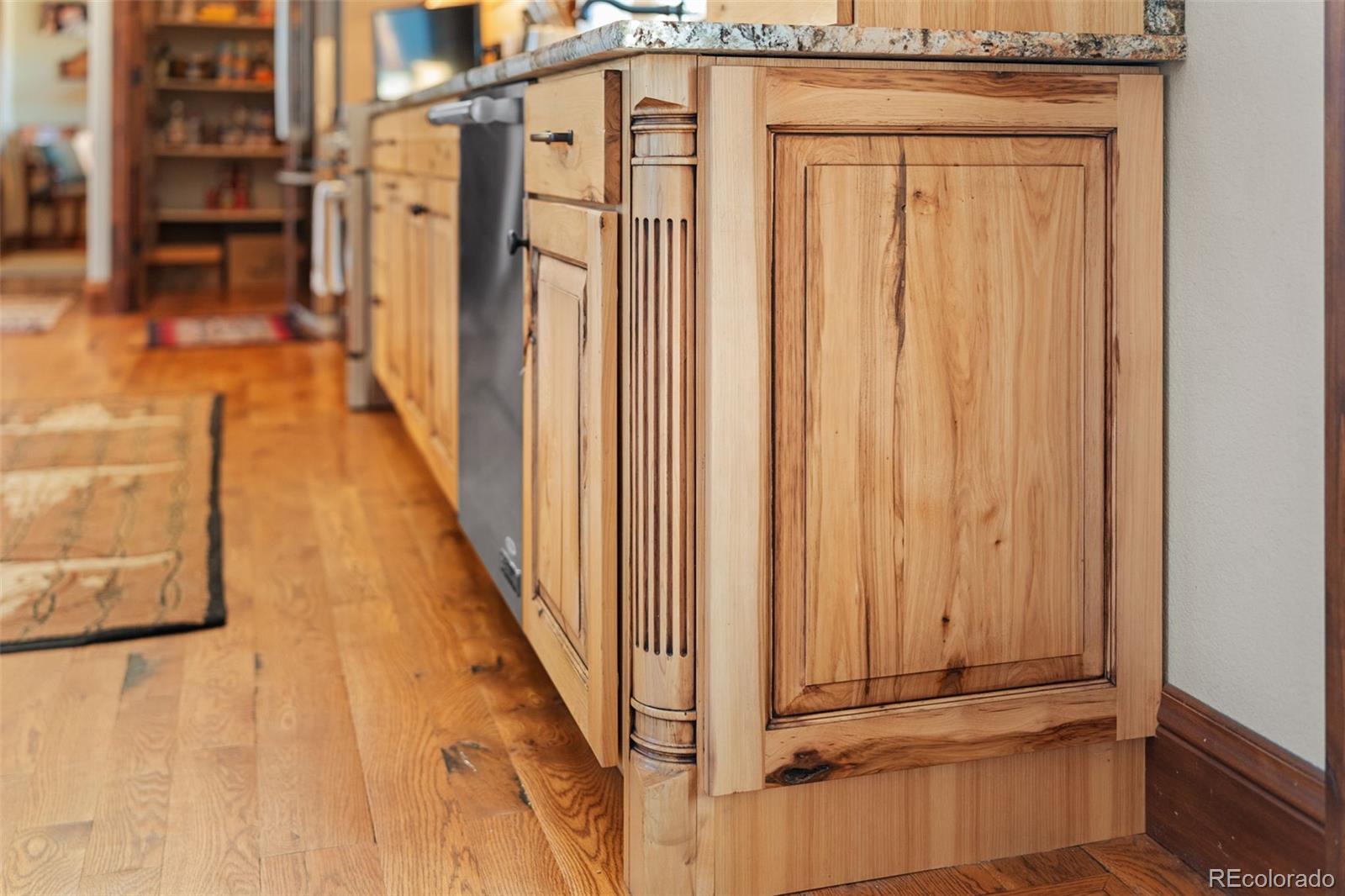 12875 Holmes Road Colorado Springs, CO 80908 - Photo 19 of 50 a view of a porch with wooden floor and stairs