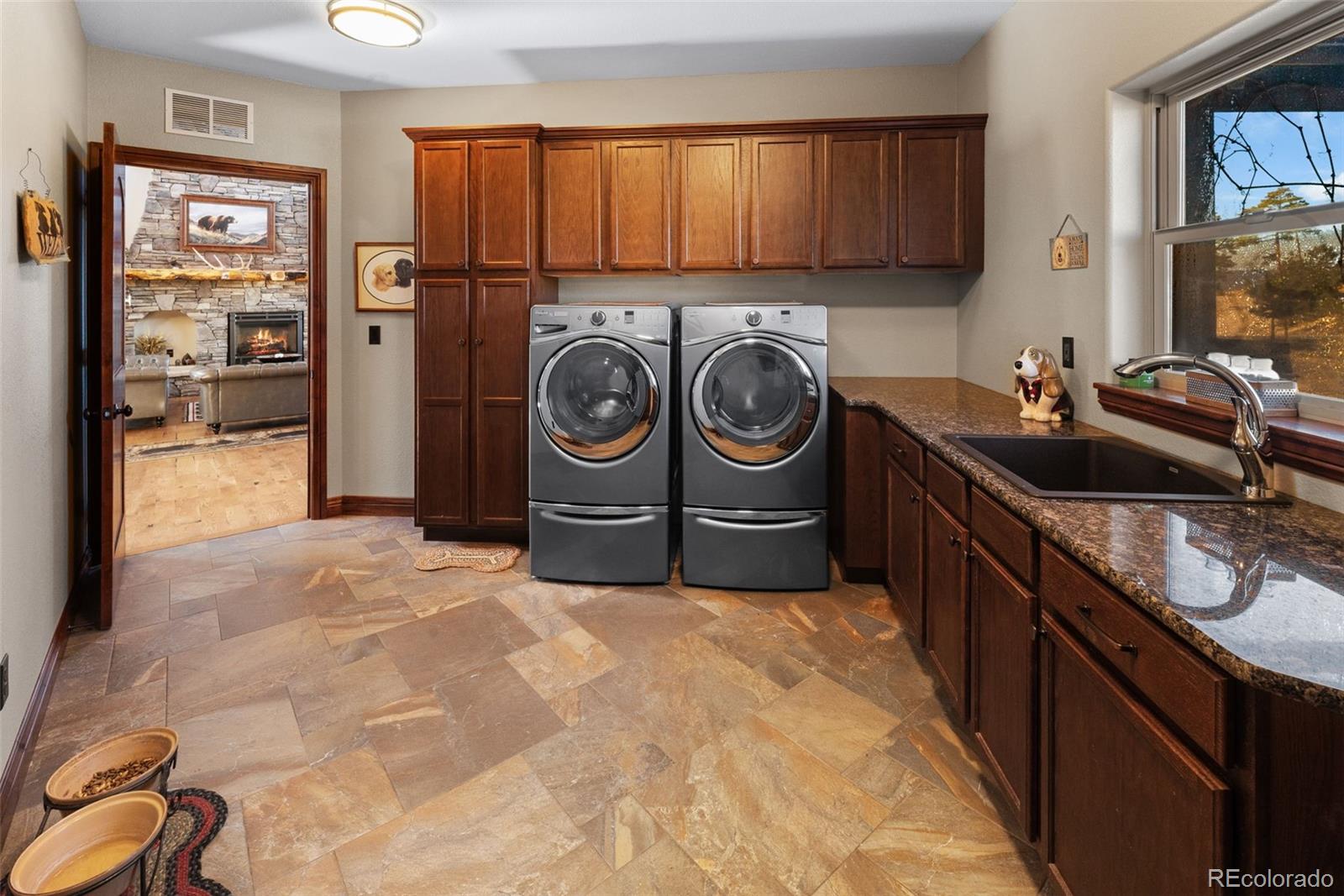 12875 Holmes Road Colorado Springs, CO 80908 - Photo 28 of 50 a kitchen with a sink and a stove top oven