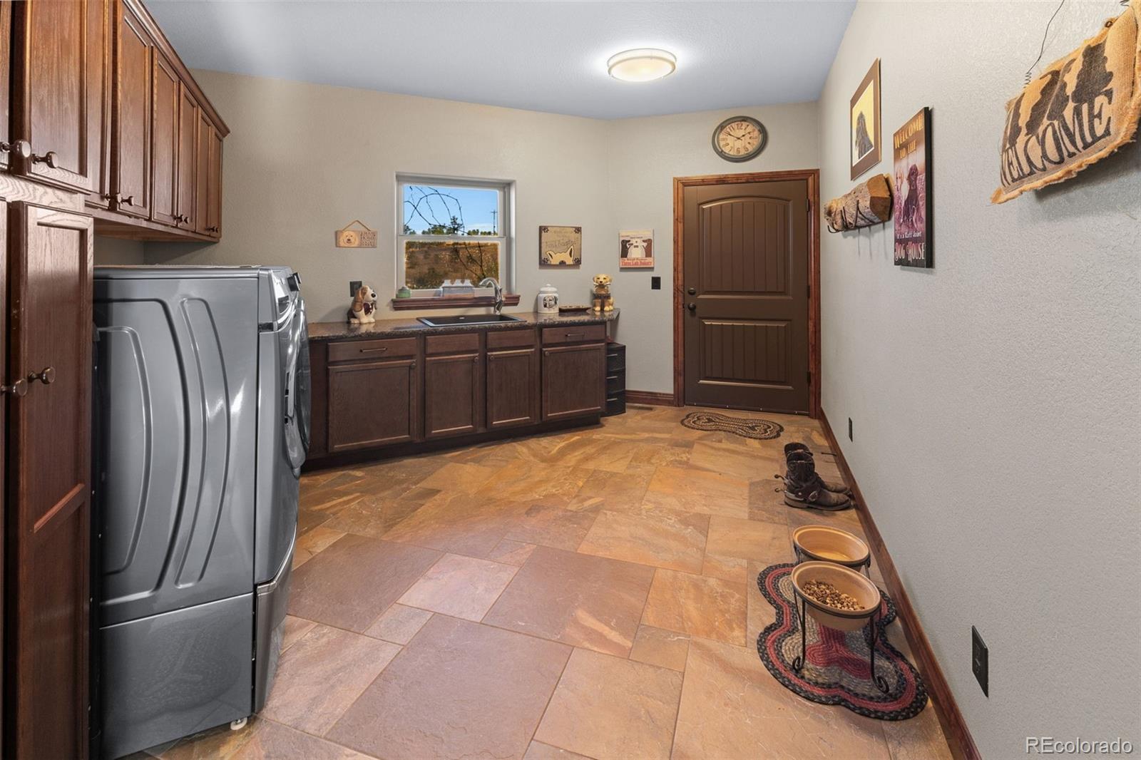 12875 Holmes Road Colorado Springs, CO 80908 - Photo 29 of 50 a kitchen with stainless steel appliances granite countertop a refrigerator and a stove