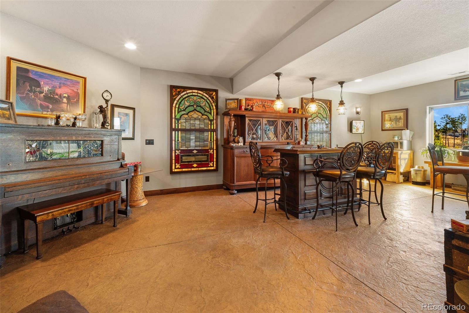 12875 Holmes Road Colorado Springs, CO 80908 - Photo 37 of 50 a living room with furniture and wooden floor
