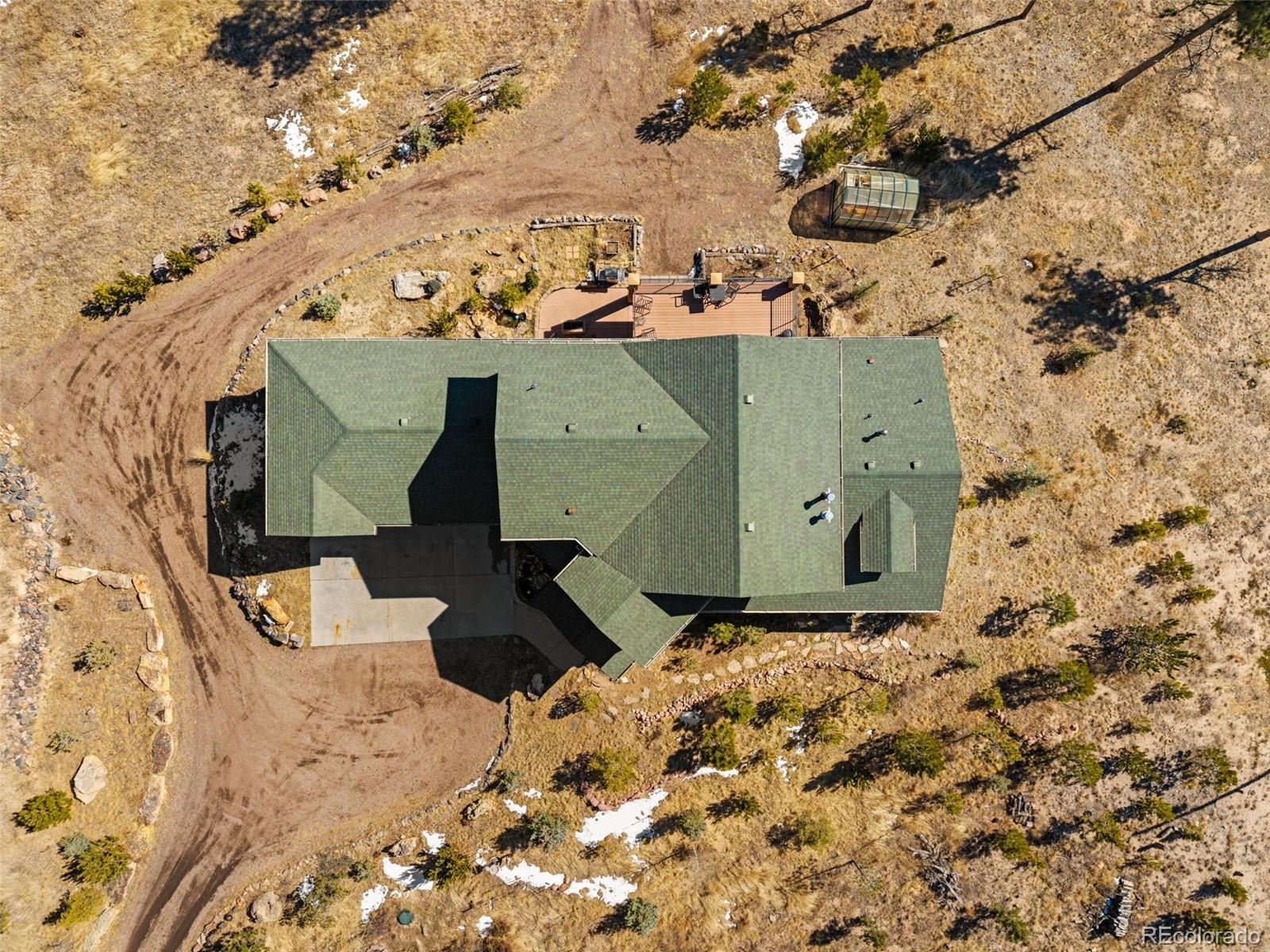 12875 Holmes Road Colorado Springs, CO 80908 - Photo 46 of 50 an aerial view of a house with a yard