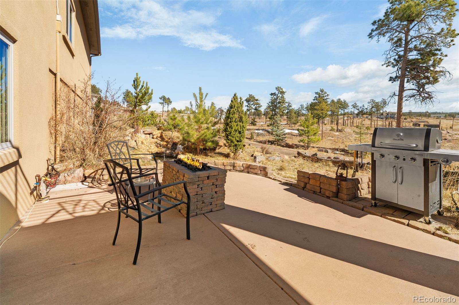 12875 Holmes Road Colorado Springs, CO 80908 - Photo 49 of 50 a view of a terrace with furniture and city view