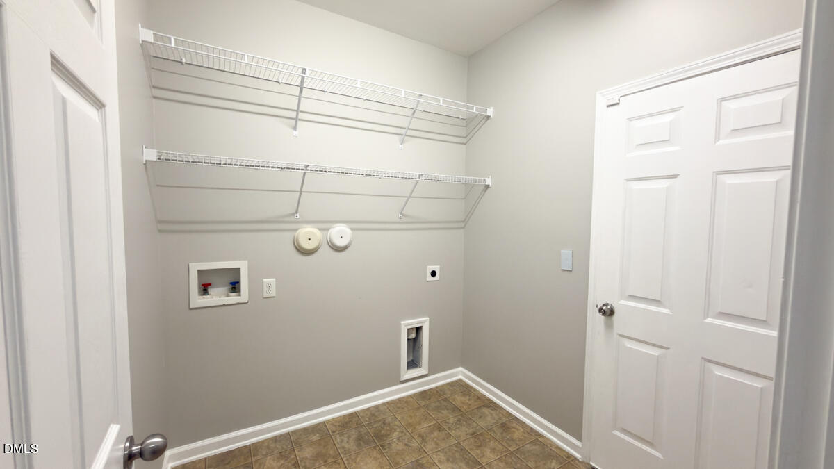 2608 Follow Me Way Raleigh, NC 27610 - Photo 14 of 32 a view of a room with racks on the wall