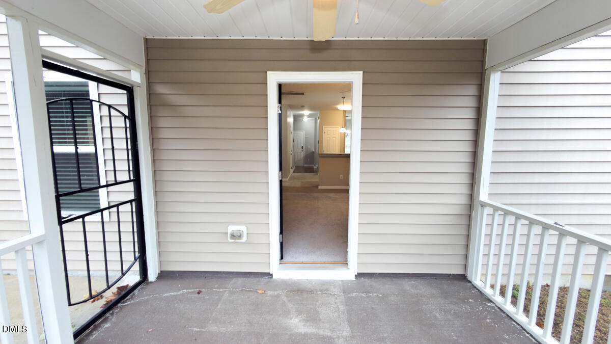 2608 Follow Me Way Raleigh, NC 27610 - Photo 19 of 32 a view of a porch with a door and wooden floor