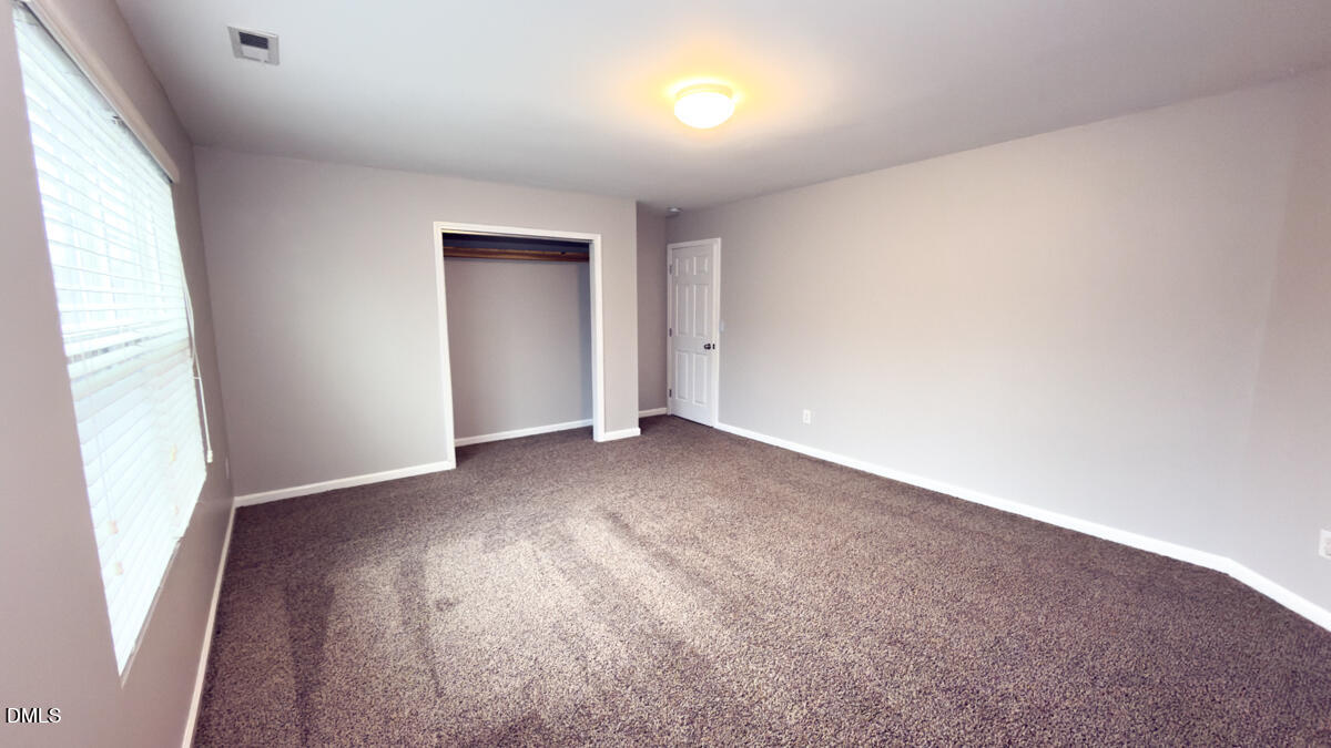 2608 Follow Me Way Raleigh, NC 27610 - Photo 22 of 32 an empty room with a window