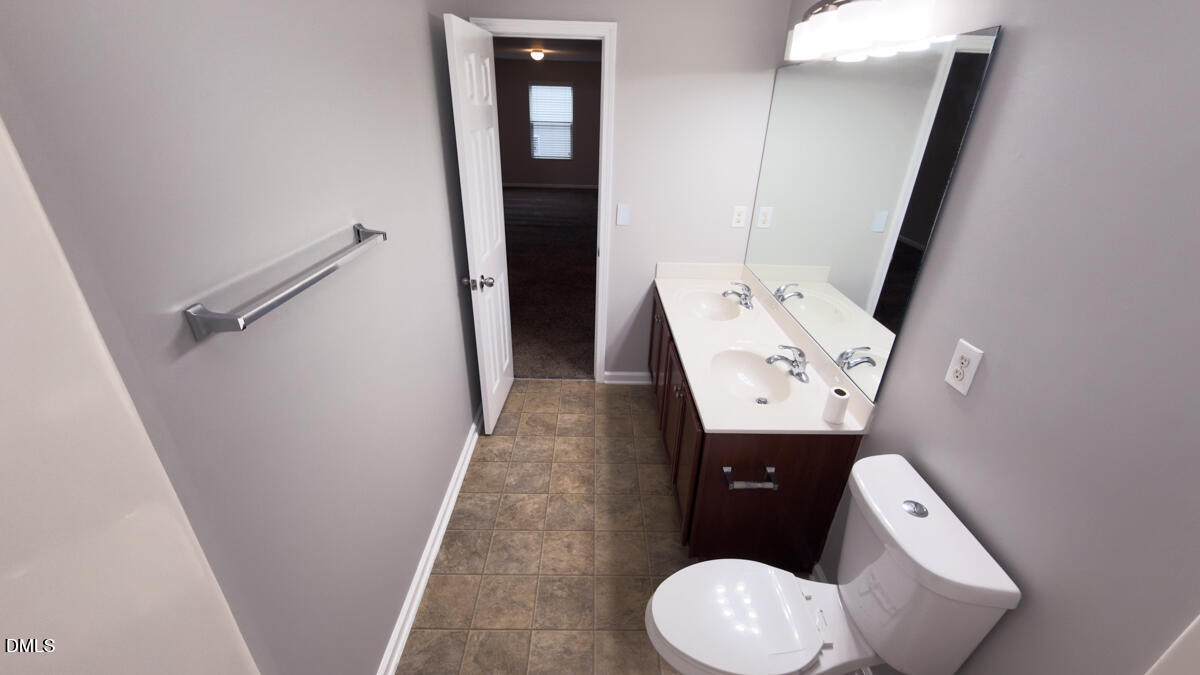 2608 Follow Me Way Raleigh, NC 27610 - Photo 25 of 32 view of bathroom with a toilet and sink