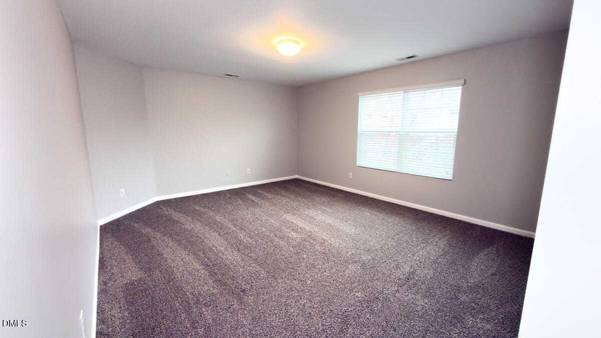 2608 Follow Me Way Raleigh, NC 27610 - Photo 28 of 32 an empty room with a window