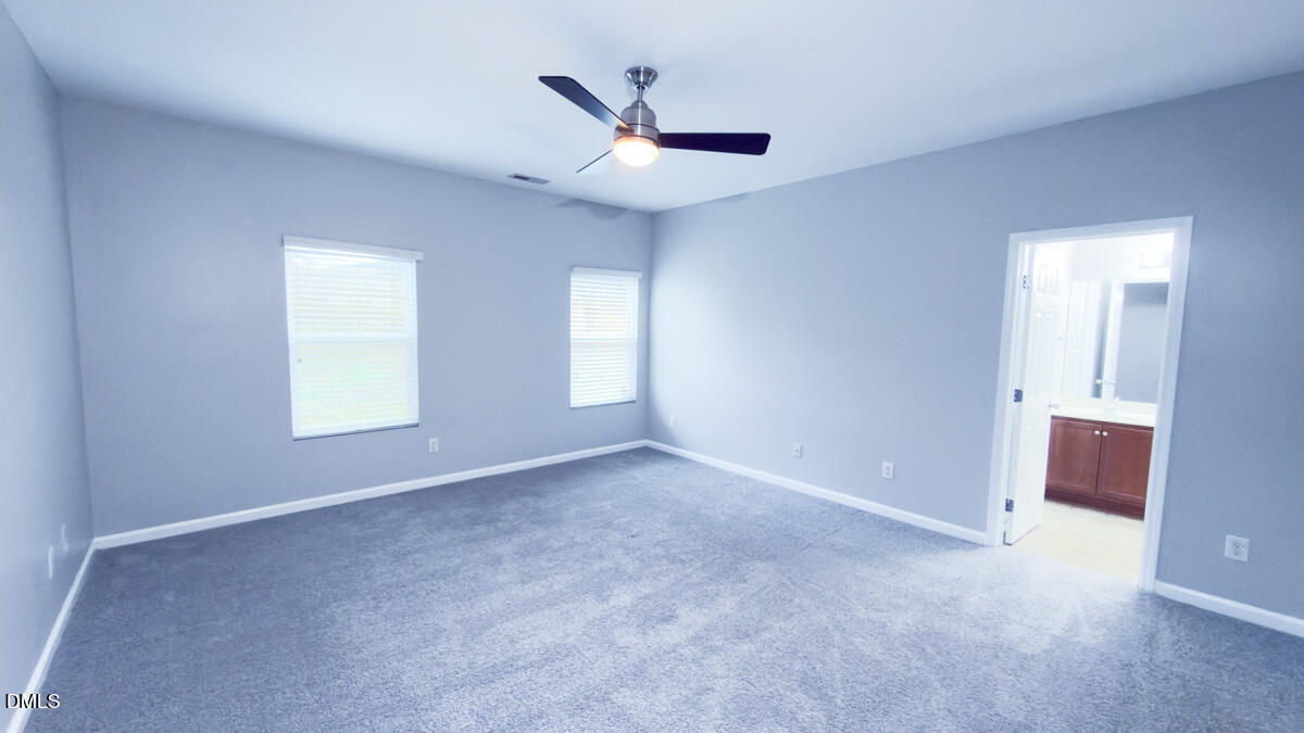2608 Follow Me Way Raleigh, NC 27610 - Photo 9 of 32 a view of an empty room with a window