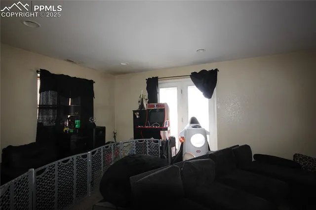 a front view of a house with a potted plant