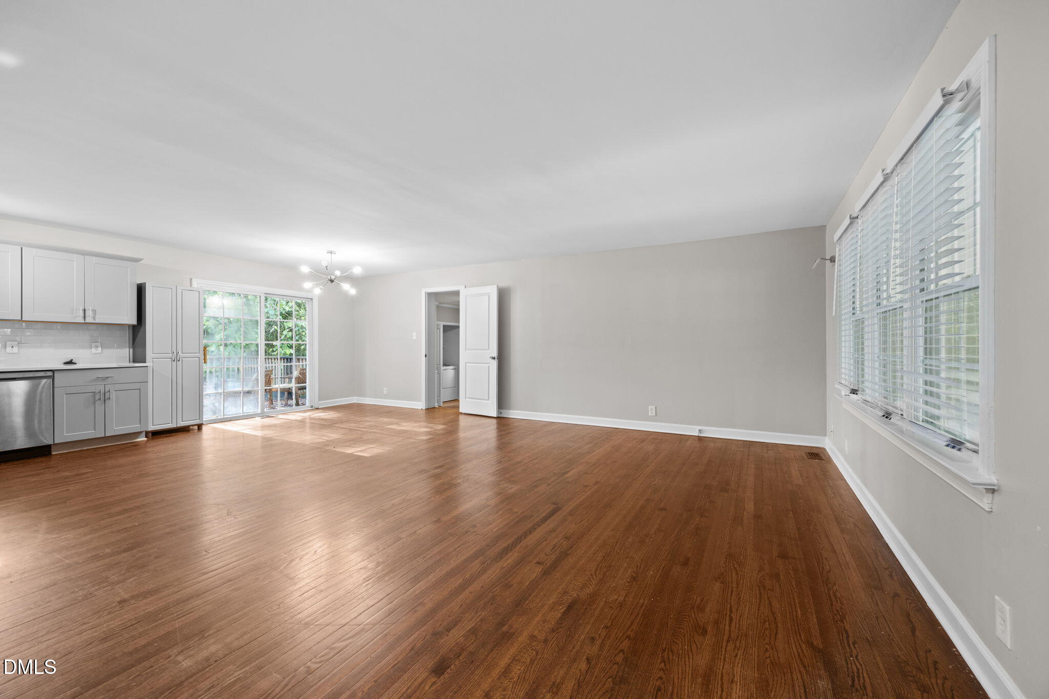 2950 Glenridge Drive Raleigh, NC 27604 - Photo 13 of 53 a view of empty room with wooden floor and window
