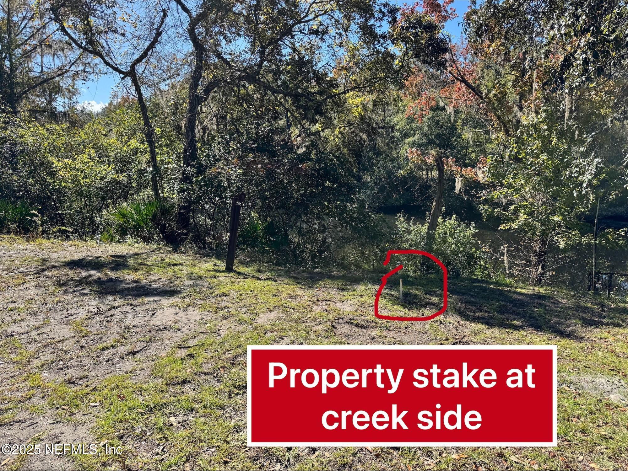4301 Lazy Acres Road Middleburg, FL 32068 - Photo 6 of 9 a view of outdoor space with sign board
