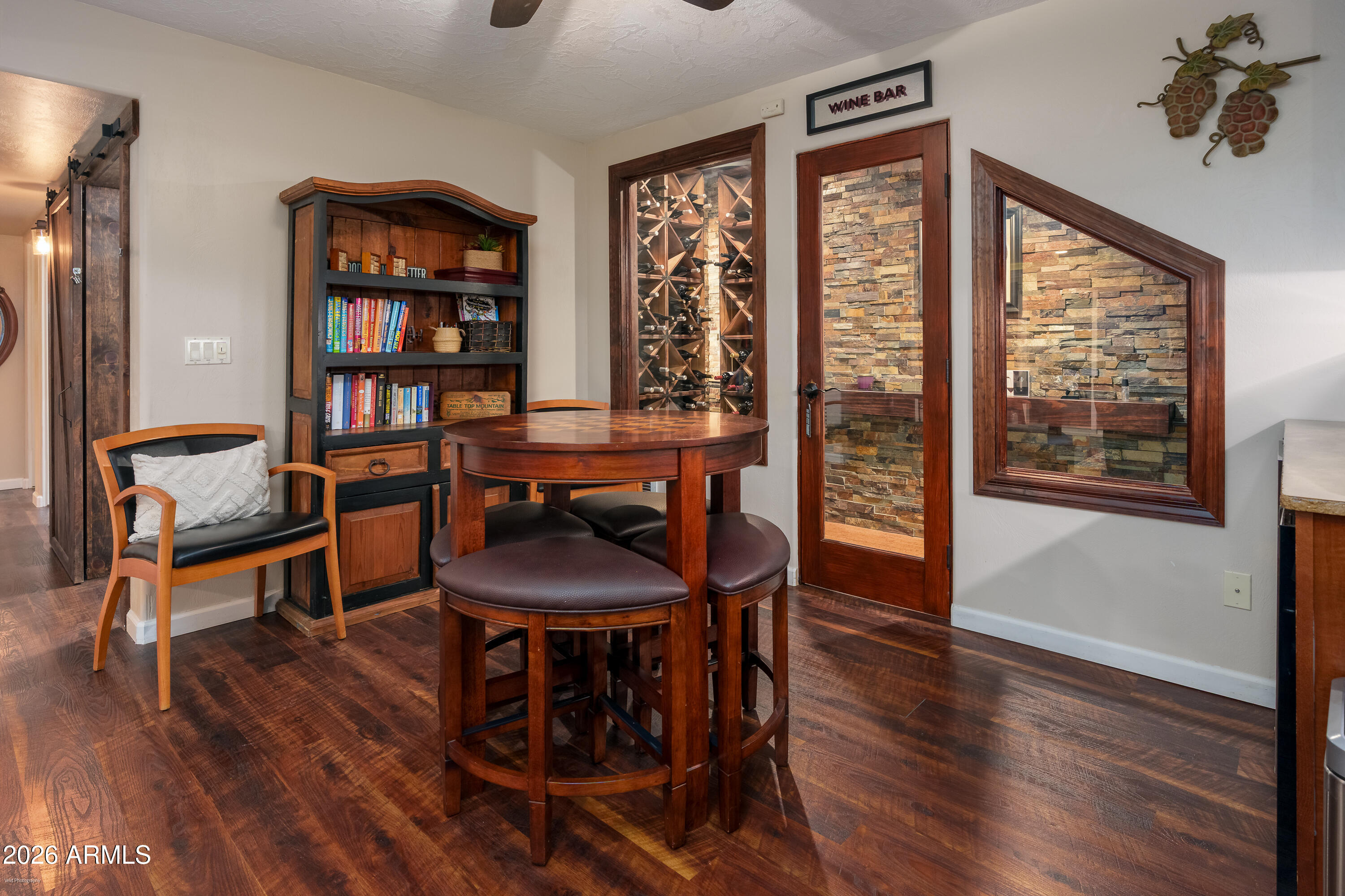 4550 Hopewell Mine Road Clarkdale, AZ 86324 - Photo 36 of 97 a view of a dining room with furniture window and wooden floor