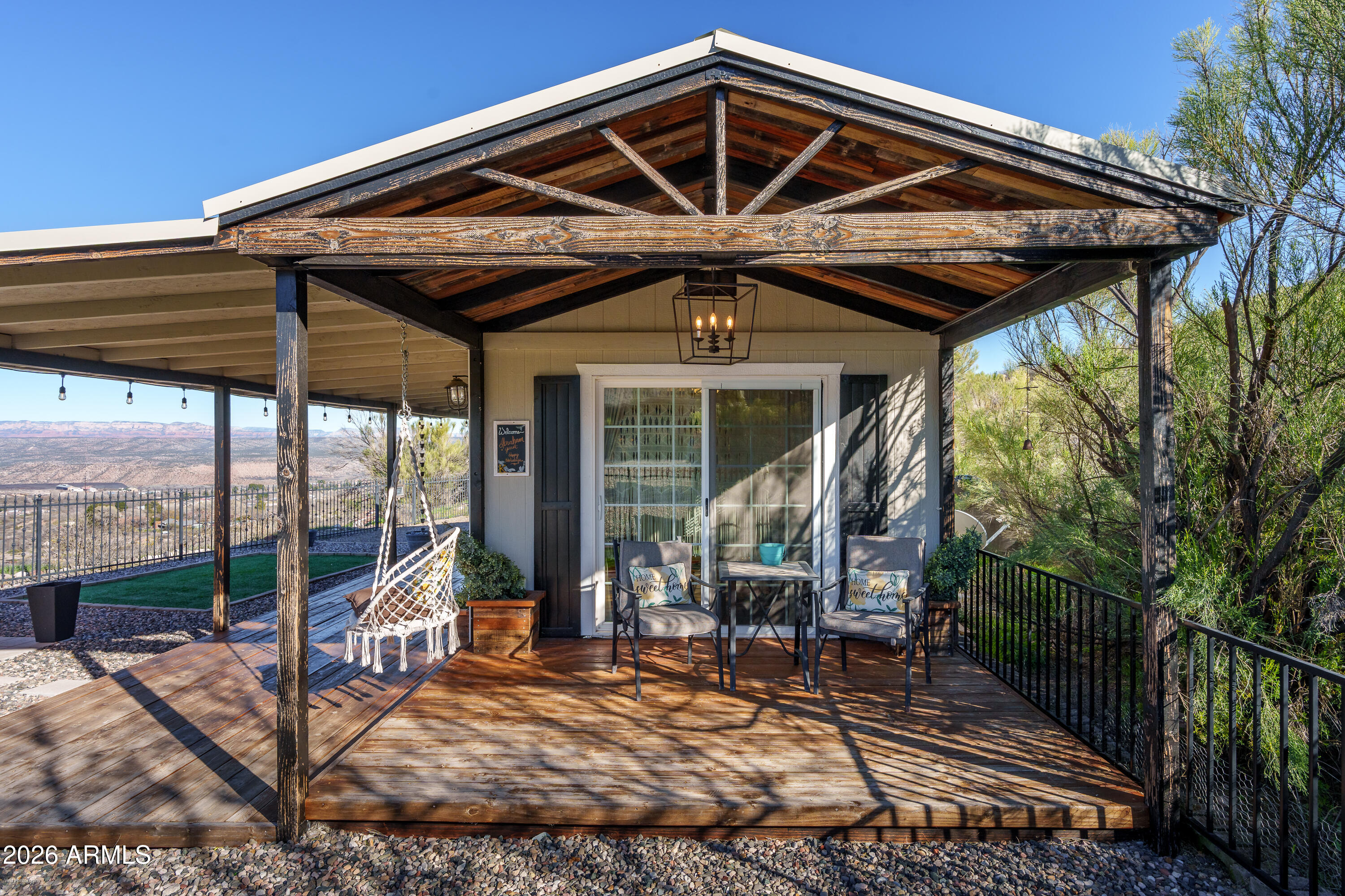 4550 Hopewell Mine Road Clarkdale, AZ 86324 - Photo 61 of 97 a front view of a house with wooden fence