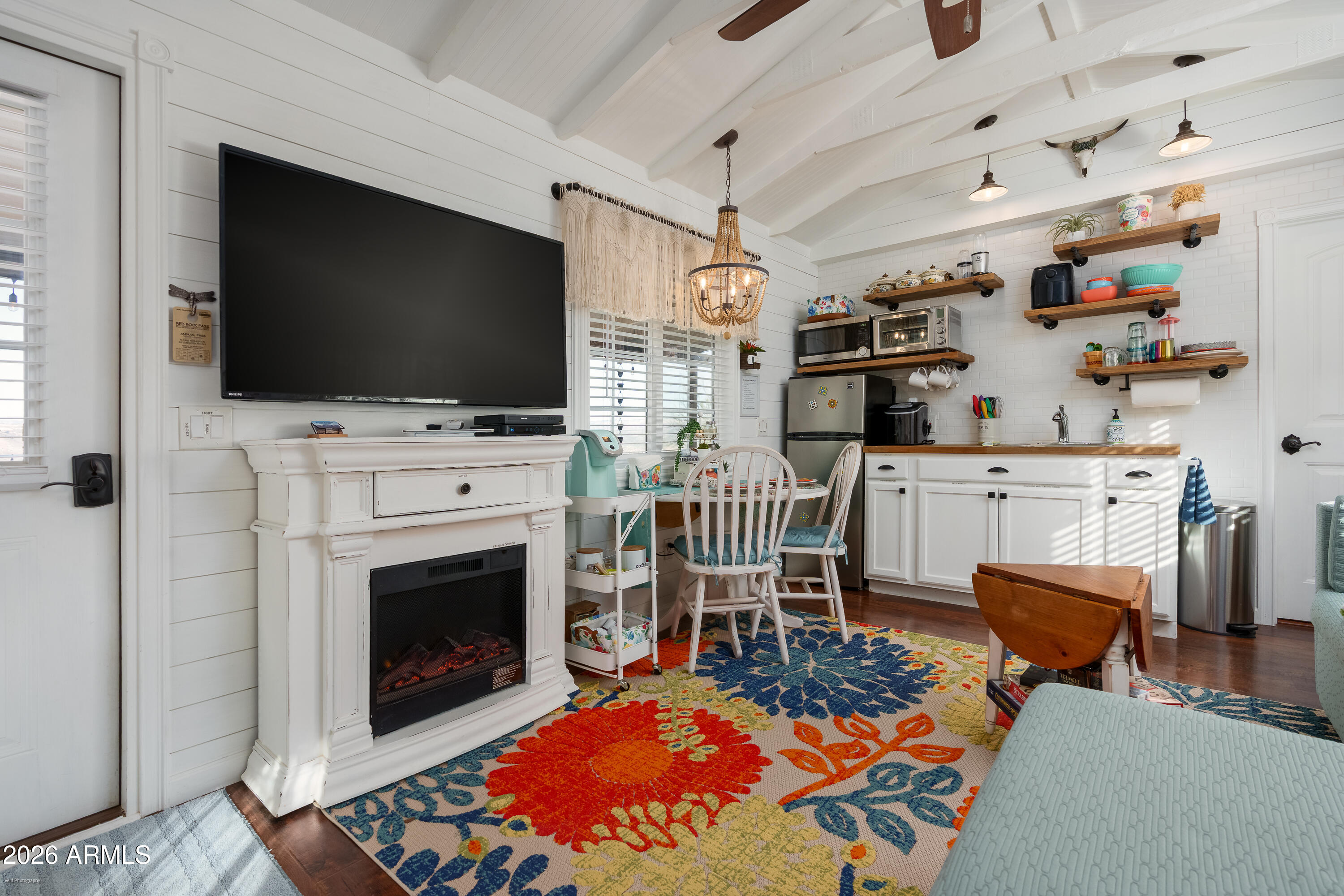 4550 Hopewell Mine Road Clarkdale, AZ 86324 - Photo 73 of 97 a living room with furniture a flat screen tv and a fireplace