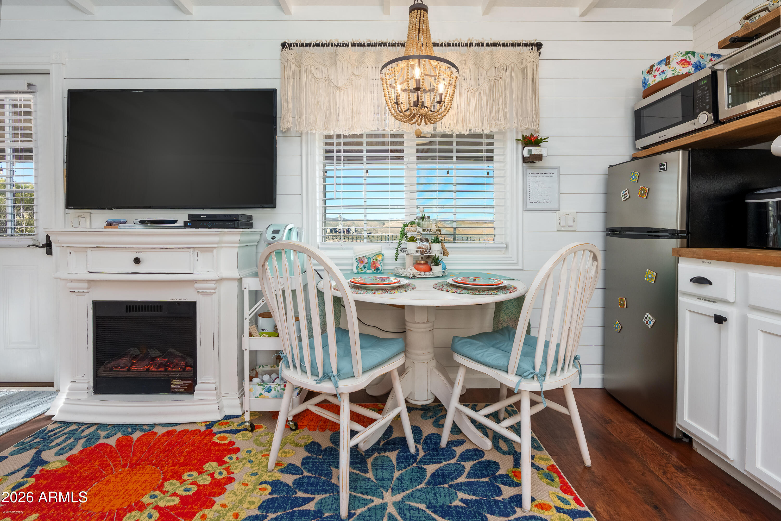 4550 Hopewell Mine Road Clarkdale, AZ 86324 - Photo 74 of 97 a living room with furniture a flat screen tv and a fireplace