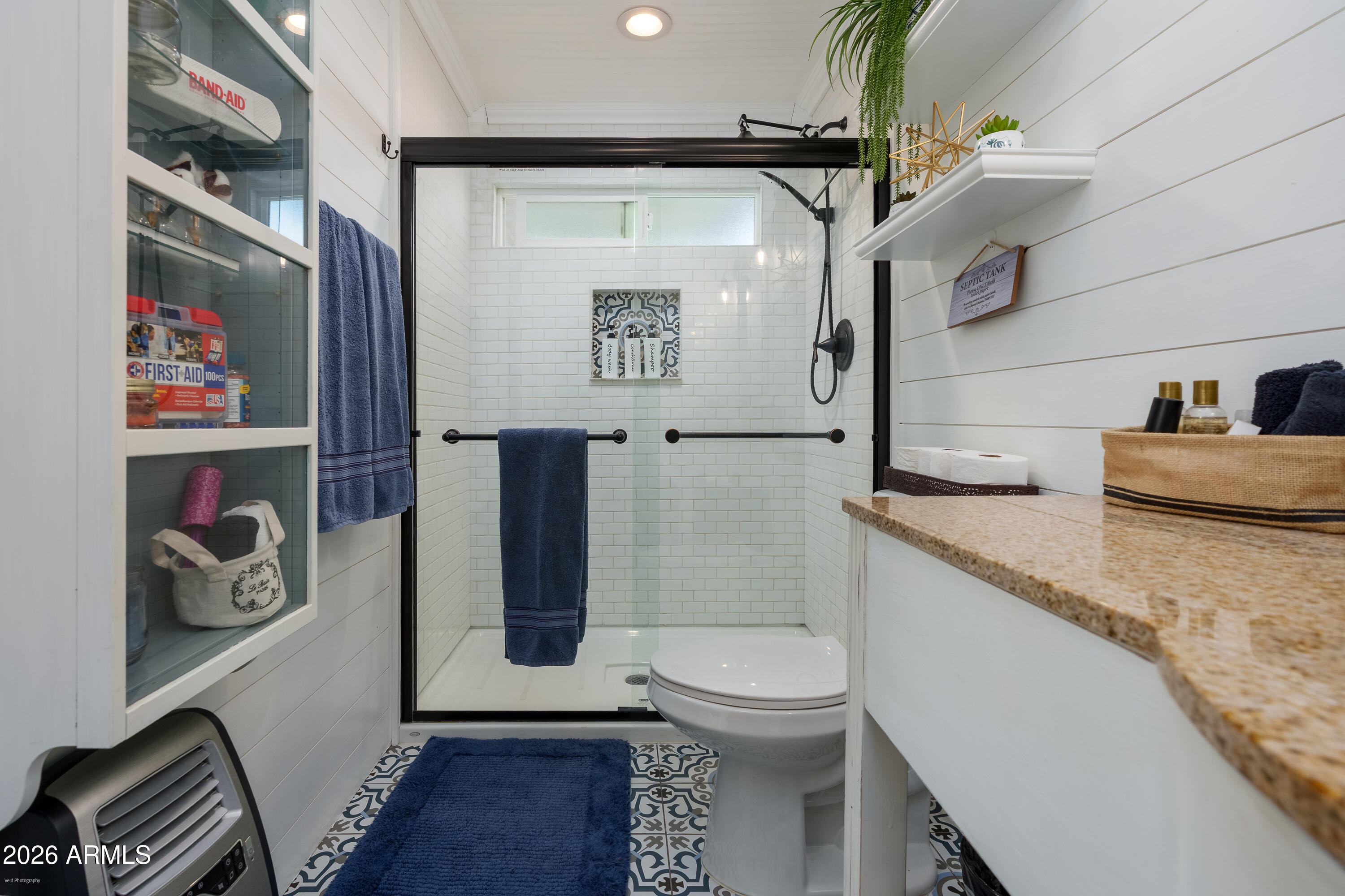 4550 Hopewell Mine Road Clarkdale, AZ 86324 - Photo 79 of 97 a bathroom with a granite countertop sink a toilet and a shower curtain