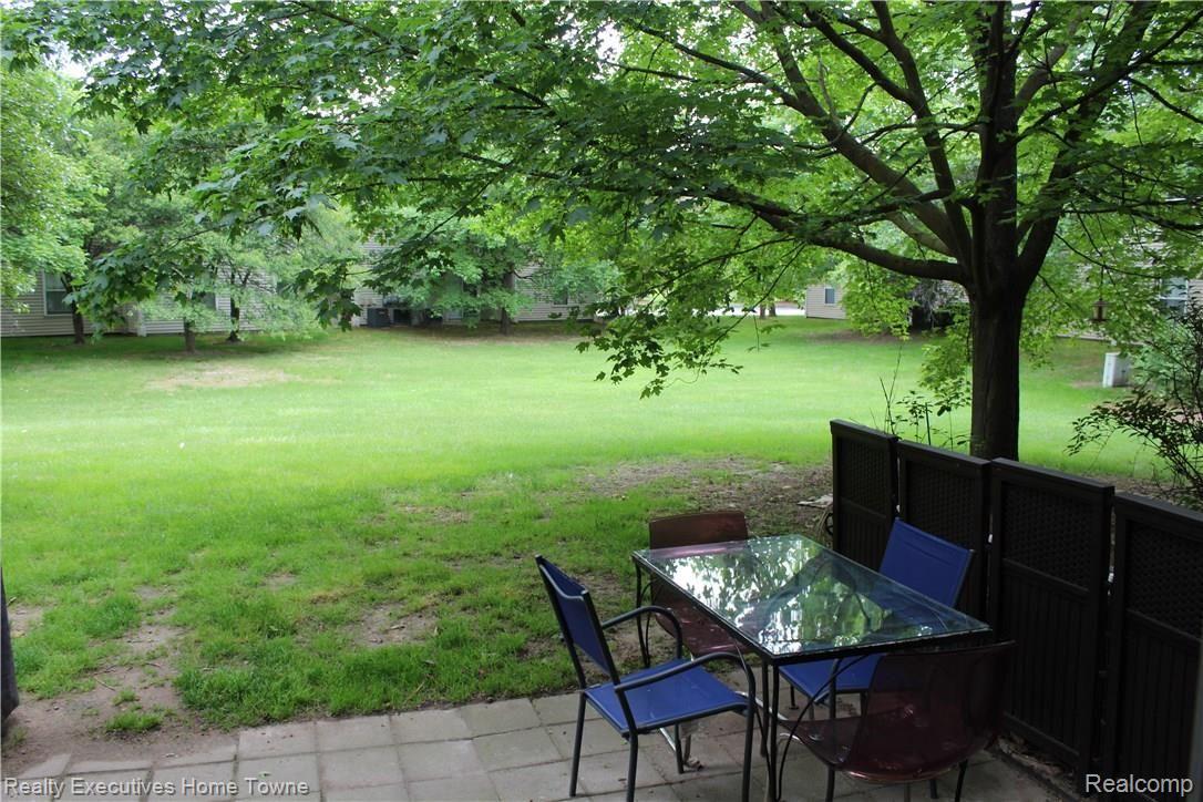 1610 O'Neil Circle Rochester, MI 48307 - Photo 30 of 49 Lovely open greenspace beyond dining area and patio.