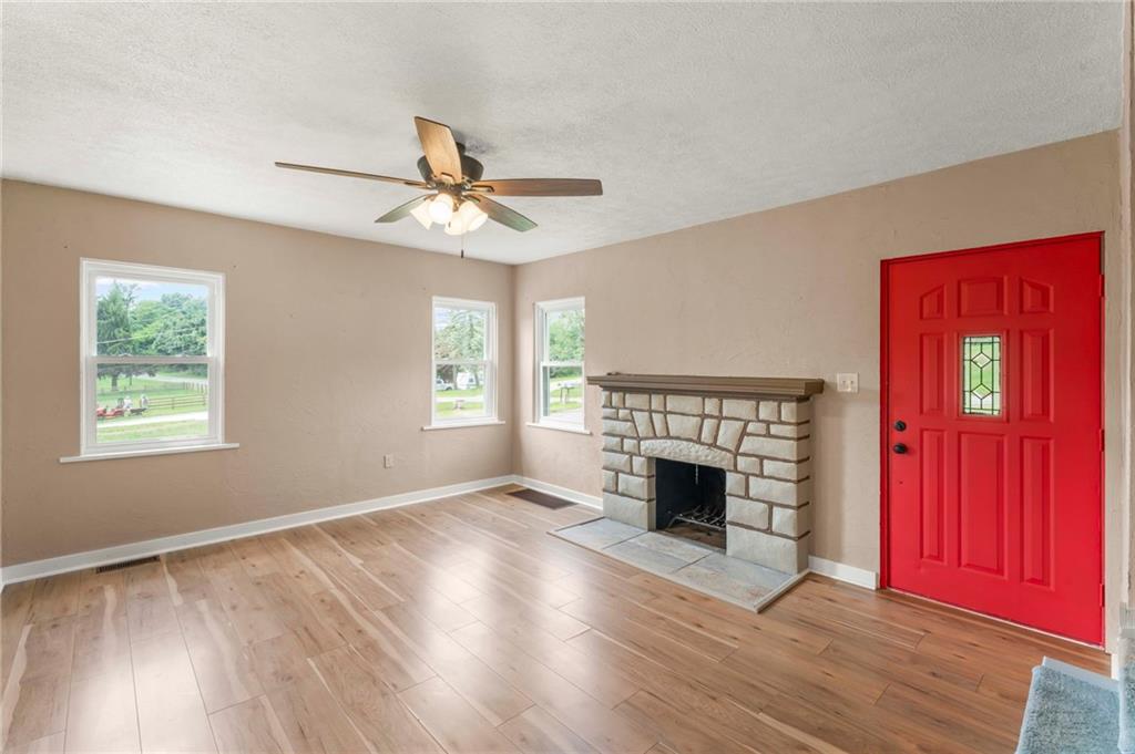 34 Meyers Road Washington, PA 15301 - Photo 10 of 34 wooden floor fireplace and windows in an empty room