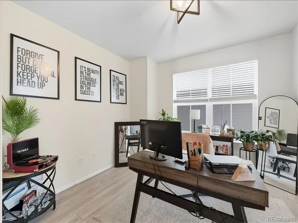 a workspace with furniture and a window
