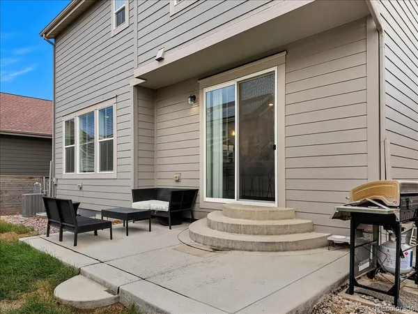 a view of a patio with chairs and a tables