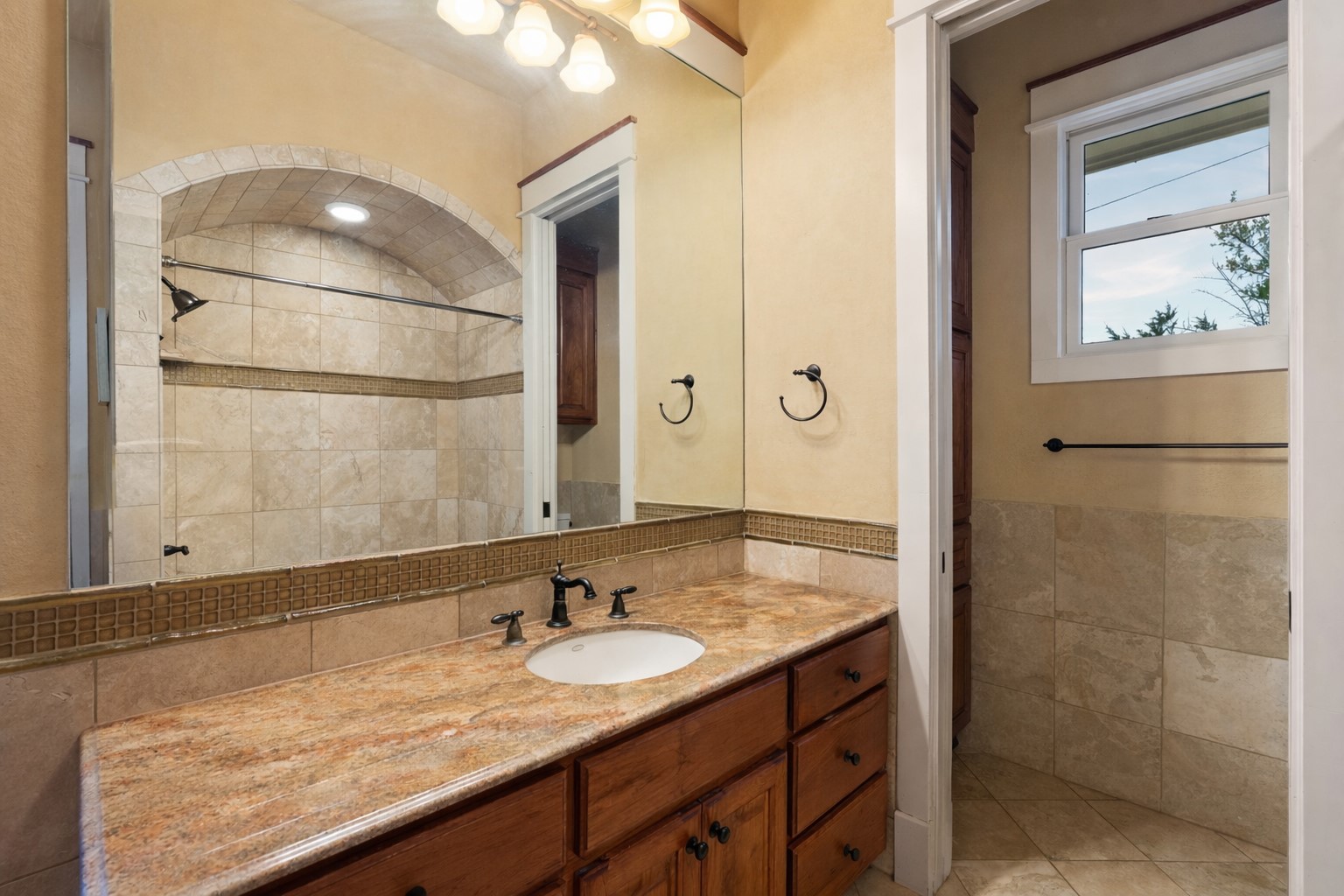 23426 Oscar Road Spicewood, TX 78669 - Photo 11 of 40 One of two full guest bathrooms in the main house. Not pictured is a walk-in shower.