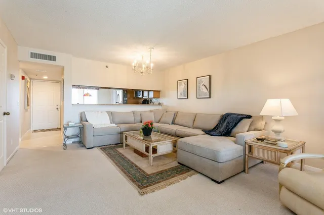 a living room with furniture and a lamp