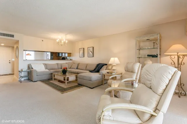 a living room with furniture and a lamp