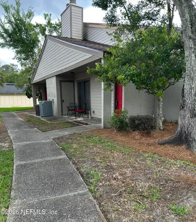 a front view of a house with yard