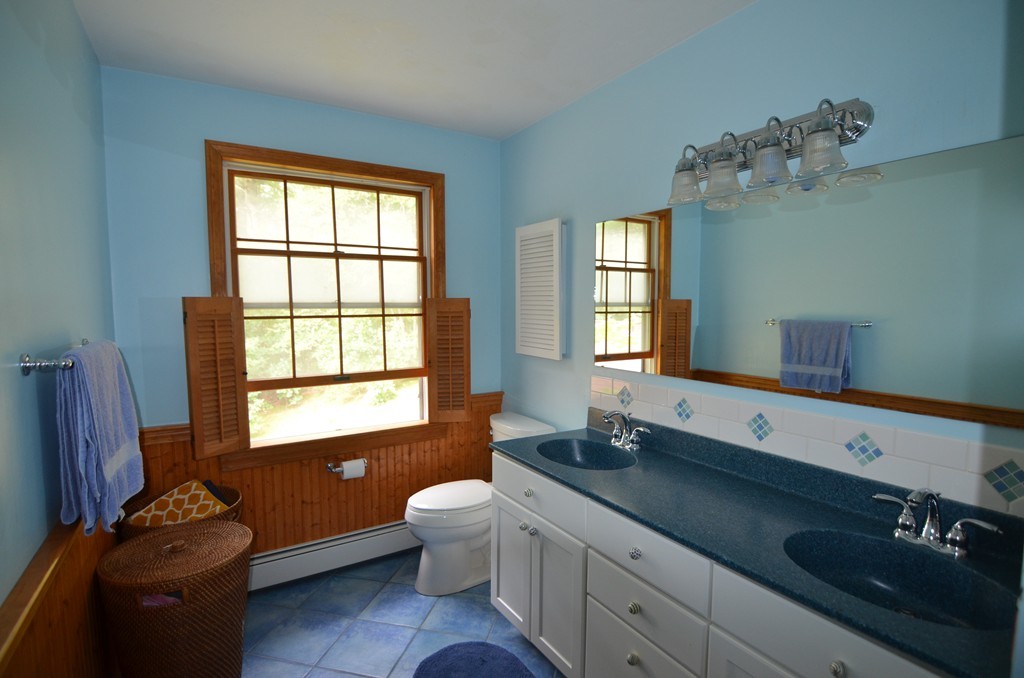 17 Oak Hill Road Harvard, MA 01451 - Photo 14 of 28 a bathroom with a granite countertop sink mirror and a window