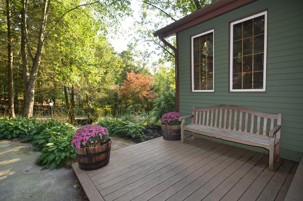 17 Oak Hill Road Harvard, MA 01451 - Photo 23 of 28 a view of a porch with a bench