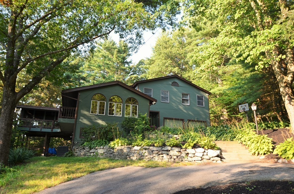17 Oak Hill Road Harvard, MA 01451 - Photo 28 of 28 a front view of a house with a yard and tree s