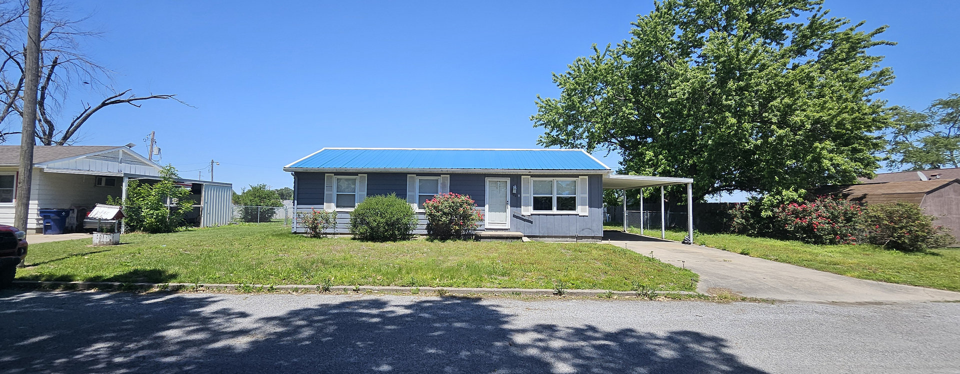 102 Mohawk Street McClure, IL 62957 - Photo 1 of 4 a front view of a house with a yard and porch