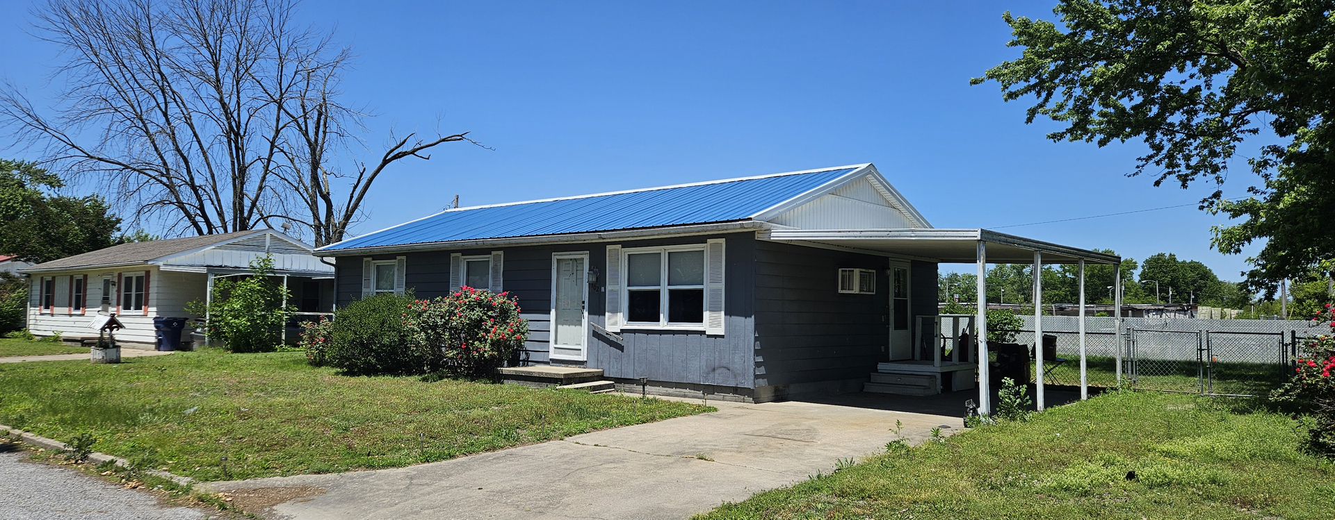 102 Mohawk Street McClure, IL 62957 - Photo 2 of 4 a front view of a house with a yard
