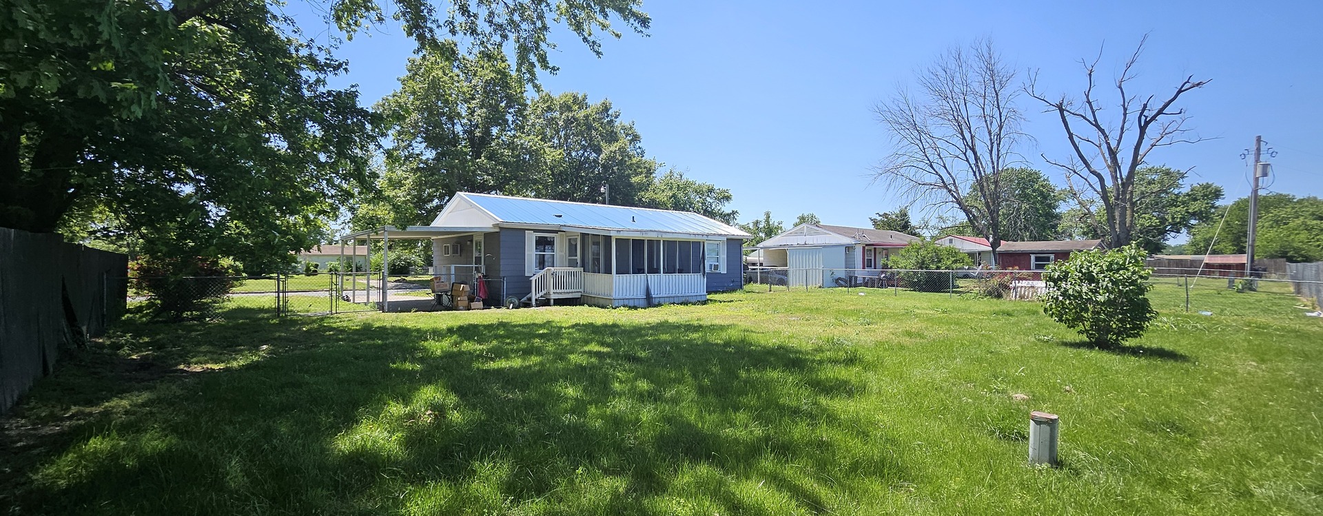 102 Mohawk Street McClure, IL 62957 - Photo 4 of 4 a front view of a house with yard patio and green space