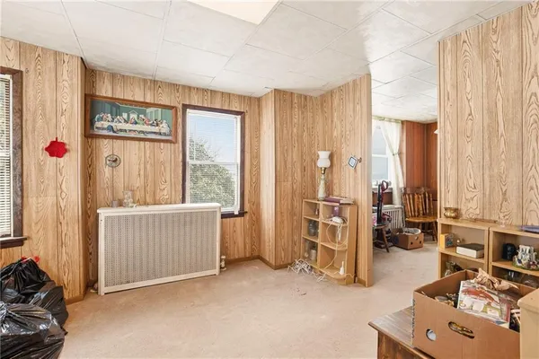 a view of a livingroom with furniture and a window