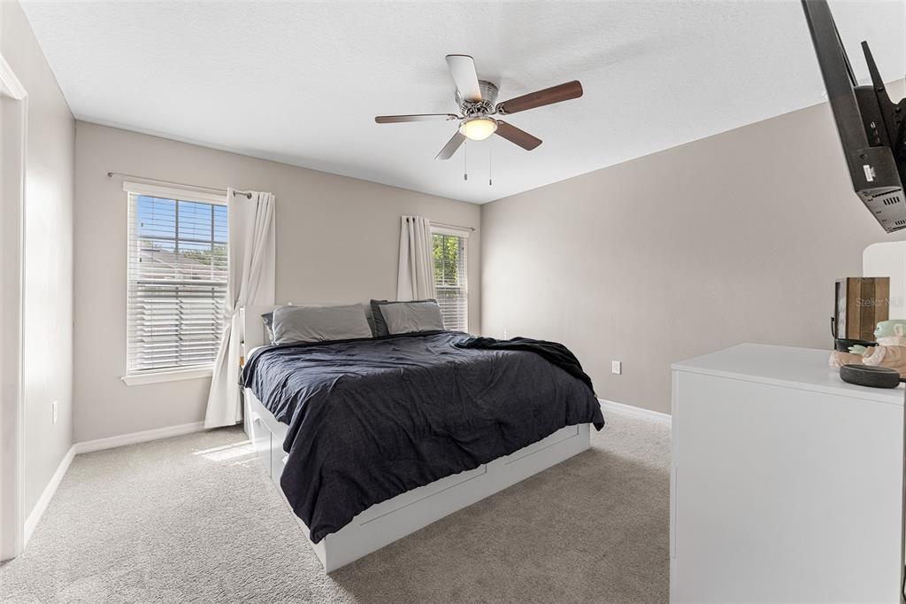 3523 Clay Brick Road St. Cloud, FL 34773 - Photo 23 of 62 a bedroom with a bed and a window