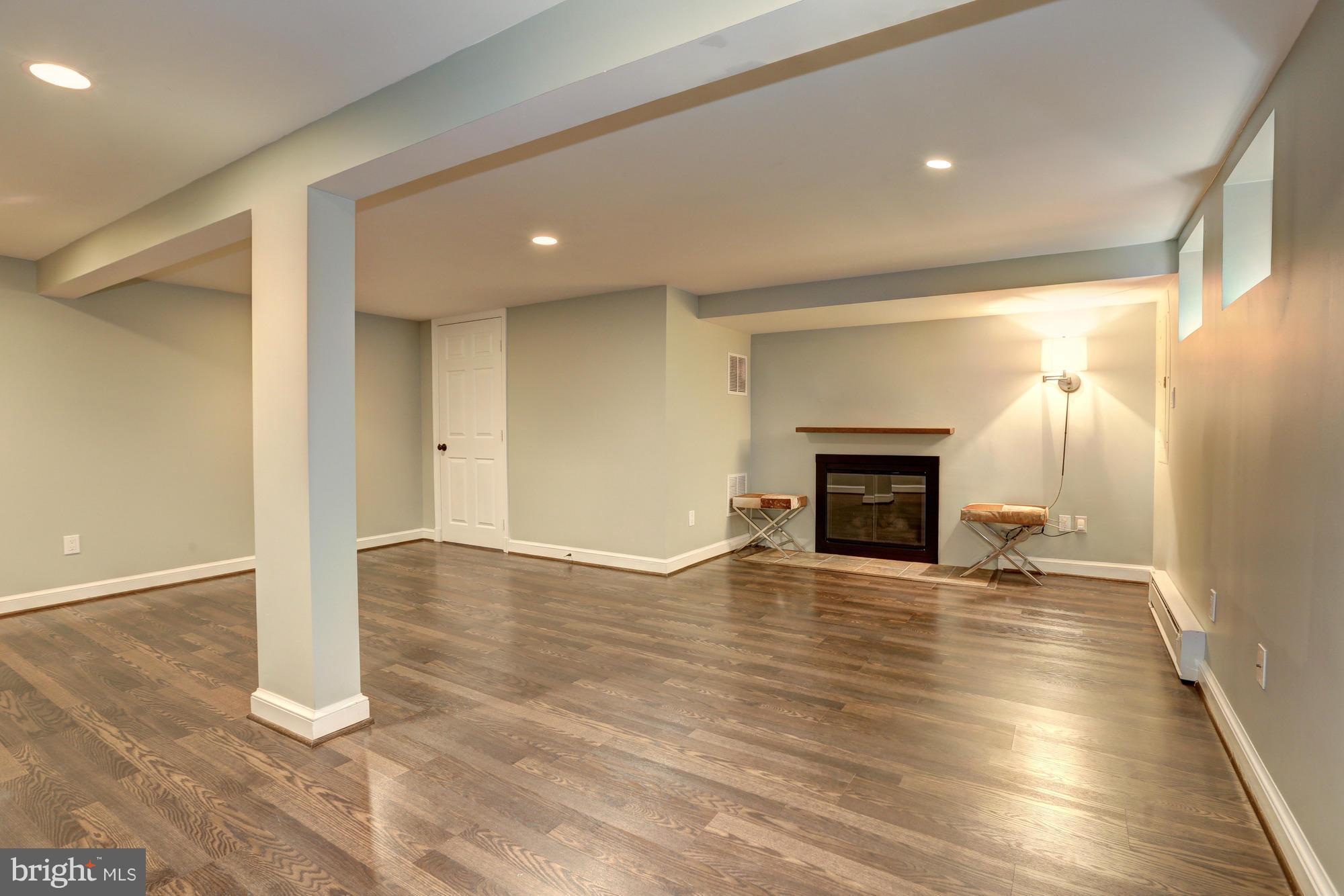5304 Wriley Road Bethesda, MD 20816 - Photo 23 of 30 Recreation Room with Gas Fireplace and Storage