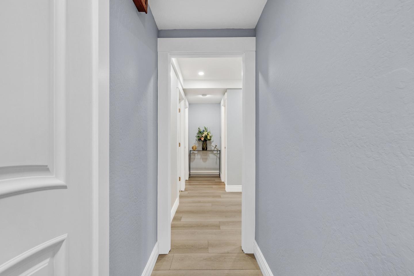 19 Elk Court Pacifica, CA 94044 - Photo 14 of 45 a view of a hallway view with wooden floor and staircase