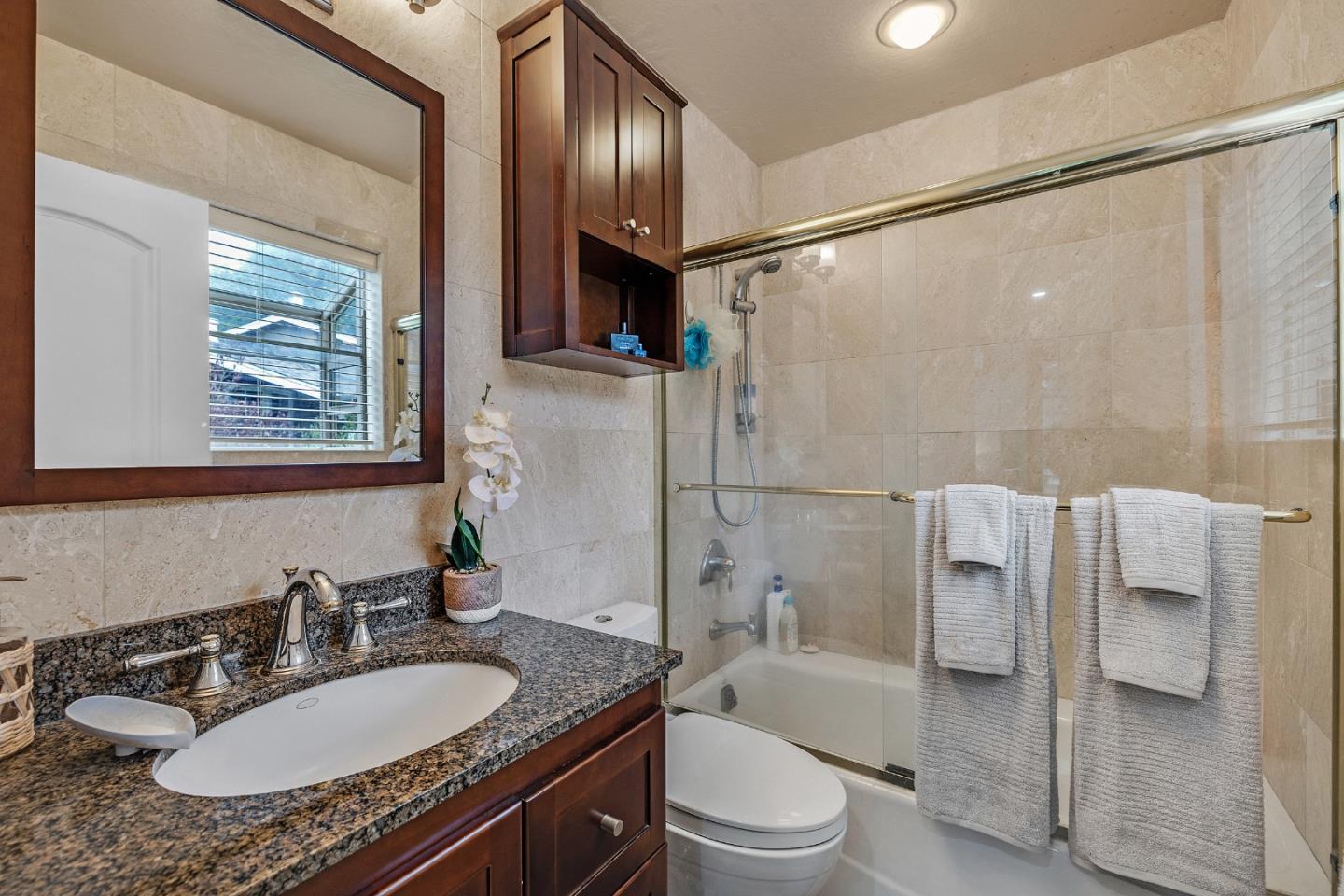 19 Elk Court Pacifica, CA 94044 - Photo 18 of 45 a bathroom with a granite countertop sink toilet and shower