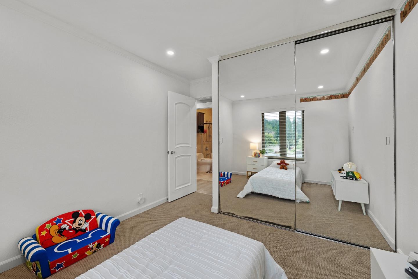 19 Elk Court Pacifica, CA 94044 - Photo 23 of 45 a bedroom with furniture and a large window