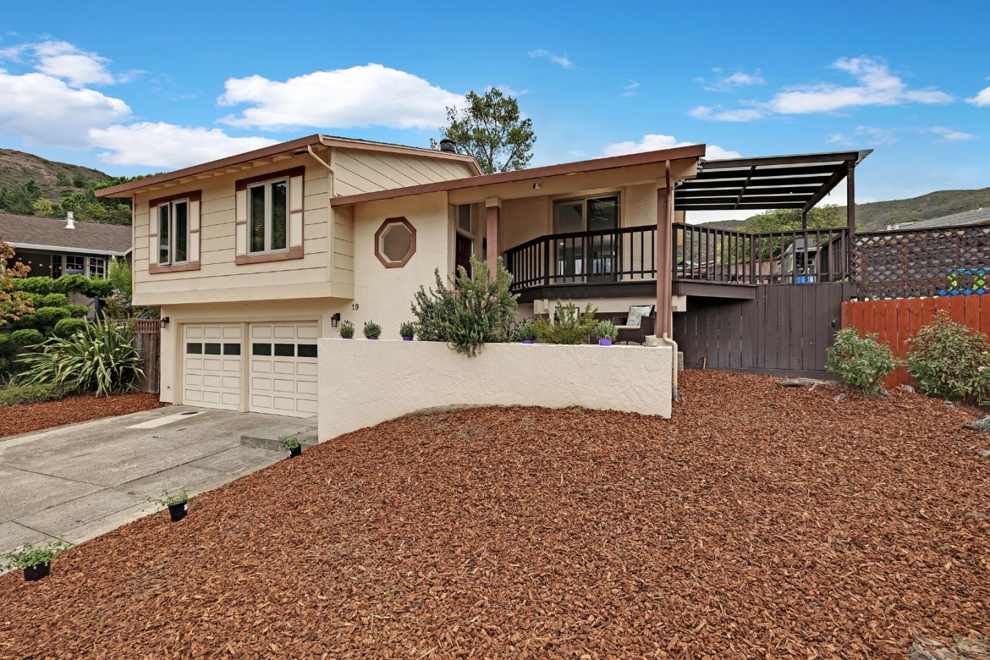 19 Elk Court Pacifica, CA 94044 - Photo 3 of 45 a front view of a house with a yard