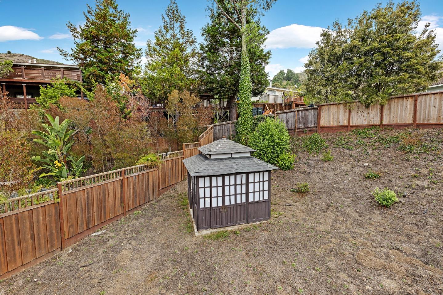19 Elk Court Pacifica, CA 94044 - Photo 39 of 45 a view of a brick house with a yard